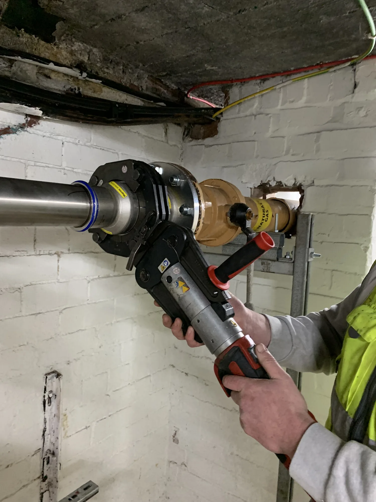 Gas Safe engineer fitting a heating component